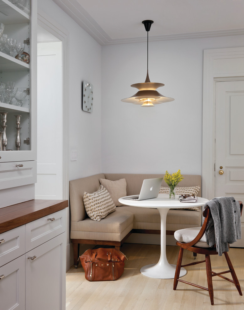 Example of a transitional dining room design in New York