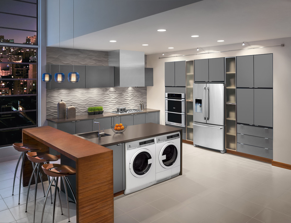Mid-sized minimalist l-shaped ceramic tile eat-in kitchen photo in New York with an undermount sink, flat-panel cabinets, gray cabinets, solid surface countertops, gray backsplash, ceramic backsplash, stainless steel appliances and two islands