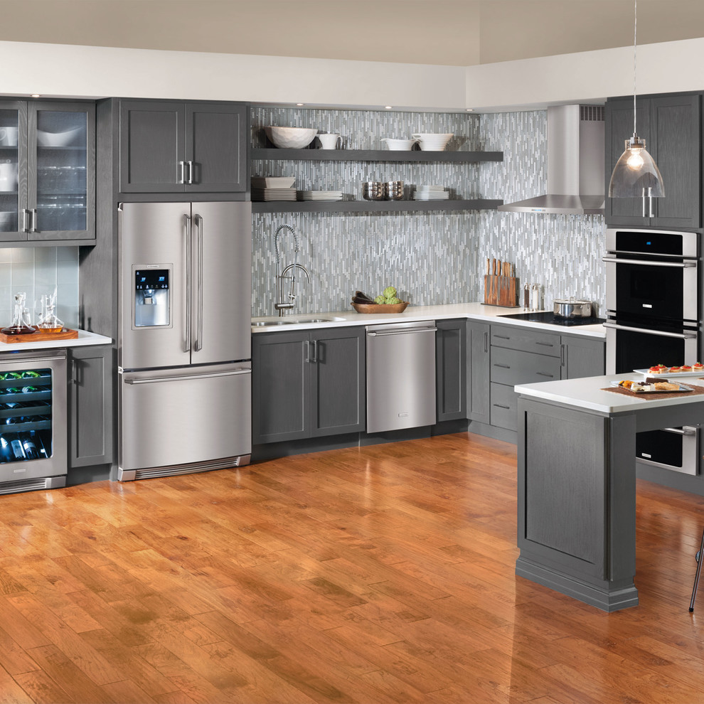 Example of a trendy kitchen design in New York with gray cabinets