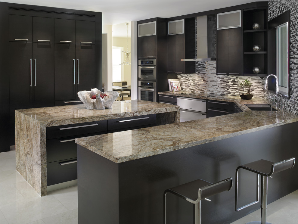 This is an example of a medium sized contemporary u-shaped enclosed kitchen in Miami with a submerged sink, flat-panel cabinets, black cabinets, marble worktops, black splashback, matchstick tiled splashback, integrated appliances, porcelain flooring, an island and white floors.