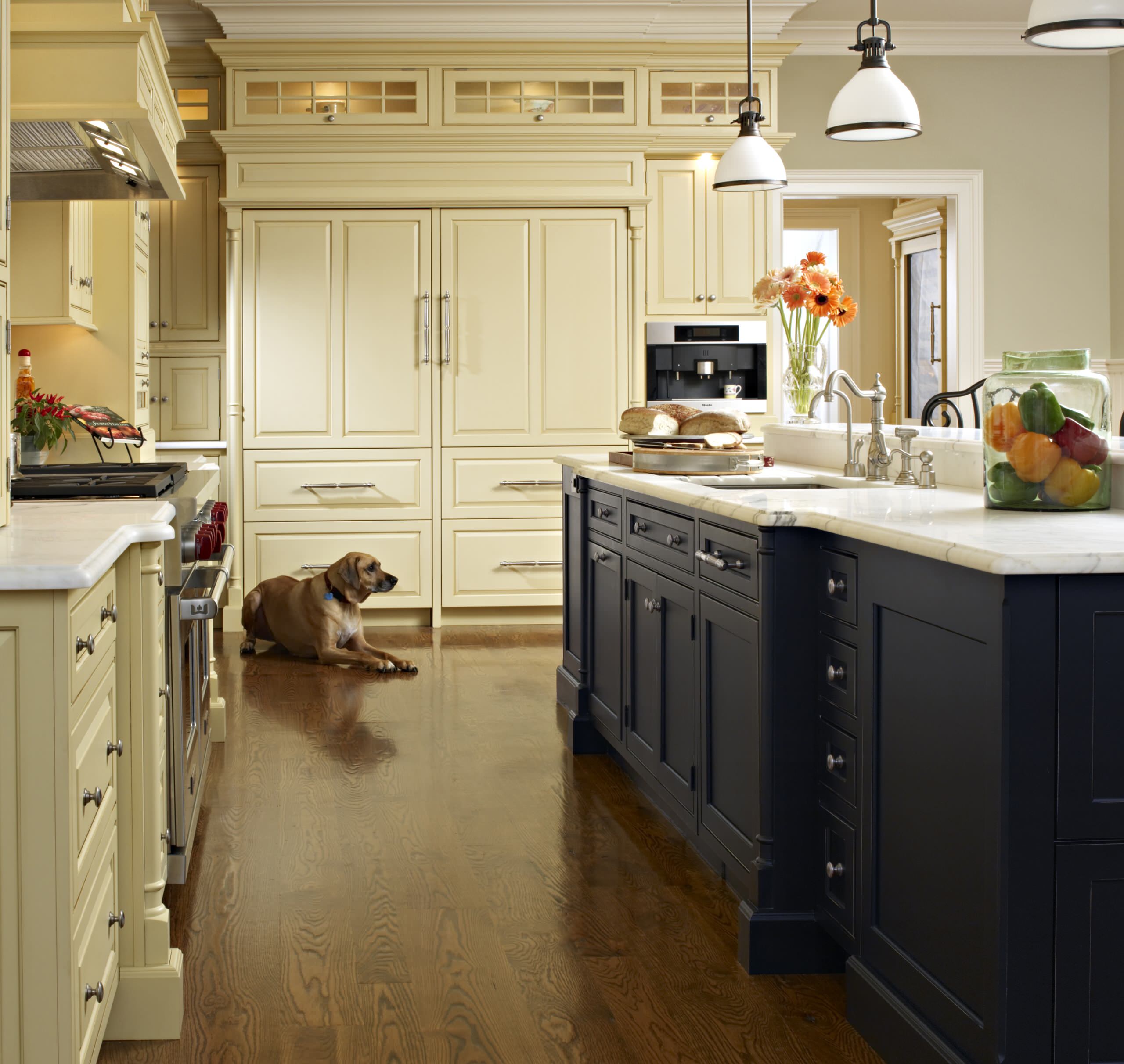 Cream Colored Kitchen With Dark Island Matttroy