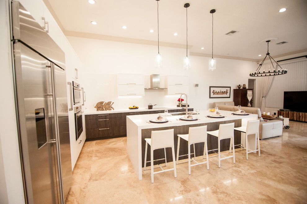 Example of a large trendy l-shaped eat-in kitchen design in Miami with an undermount sink, flat-panel cabinets, brown cabinets, quartz countertops, white backsplash, stone slab backsplash, stainless steel appliances and an island