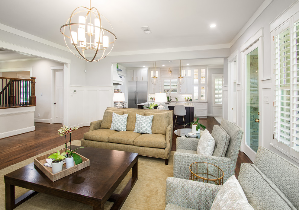 Open concept kitchen - large transitional l-shaped dark wood floor and brown floor open concept kitchen idea in Dallas with a drop-in sink, flat-panel cabinets, white cabinets, quartzite countertops, white backsplash, ceramic backsplash, stainless steel appliances, an island and gray countertops