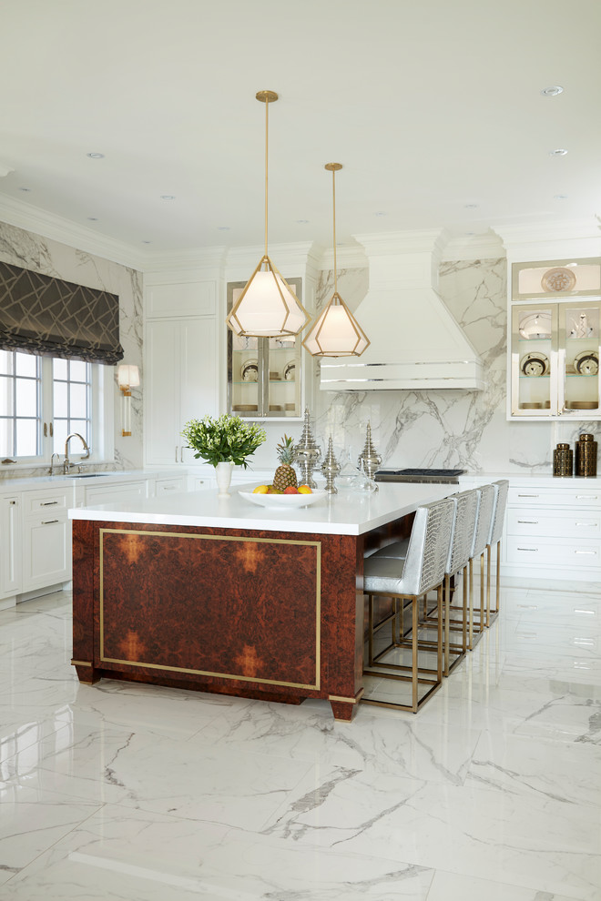 Inspiration for a large traditional l-shaped kitchen in Toronto with white cabinets, engineered stone countertops, an island, white worktops, a single-bowl sink, shaker cabinets, white splashback, stone slab splashback and white floors.