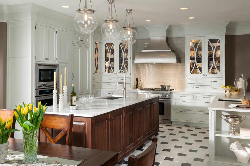 Example of a large classic u-shaped ceramic tile eat-in kitchen design in Houston with a single-bowl sink, shaker cabinets, white cabinets, marble countertops, gray backsplash, subway tile backsplash, stainless steel appliances and an island