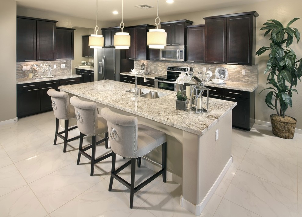 Example of a mid-sized transitional single-wall marble floor and white floor enclosed kitchen design in Austin with a double-bowl sink, recessed-panel cabinets, dark wood cabinets, granite countertops, multicolored backsplash, matchstick tile backsplash, stainless steel appliances and an island