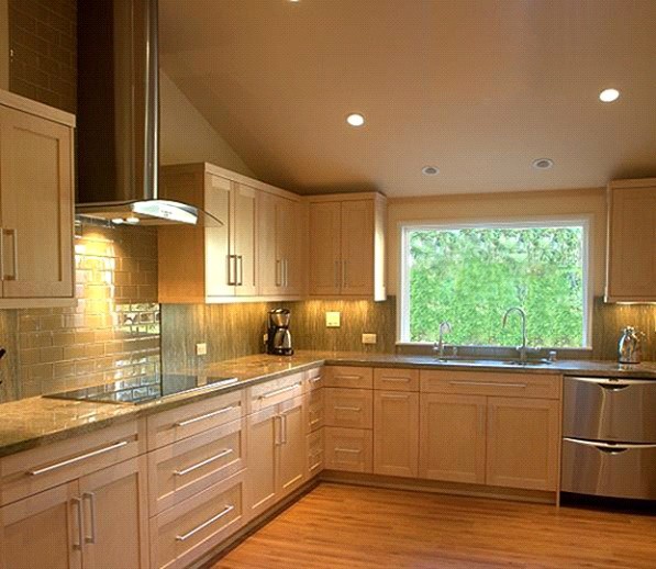 Inspiration for a mid-sized contemporary l-shaped bamboo floor and brown floor enclosed kitchen remodel in San Diego with an undermount sink, flat-panel cabinets, light wood cabinets, granite countertops, green backsplash, glass tile backsplash, black appliances and no island