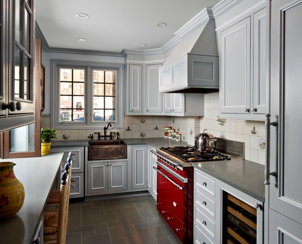 Inspiration for a traditional l-shaped enclosed kitchen in Philadelphia with a belfast sink, recessed-panel cabinets, grey cabinets, white splashback and integrated appliances.