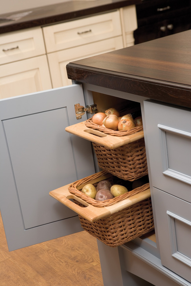 Inspiration for a timeless u-shaped eat-in kitchen remodel in Minneapolis with shaker cabinets, blue cabinets, wood countertops, blue backsplash and paneled appliances