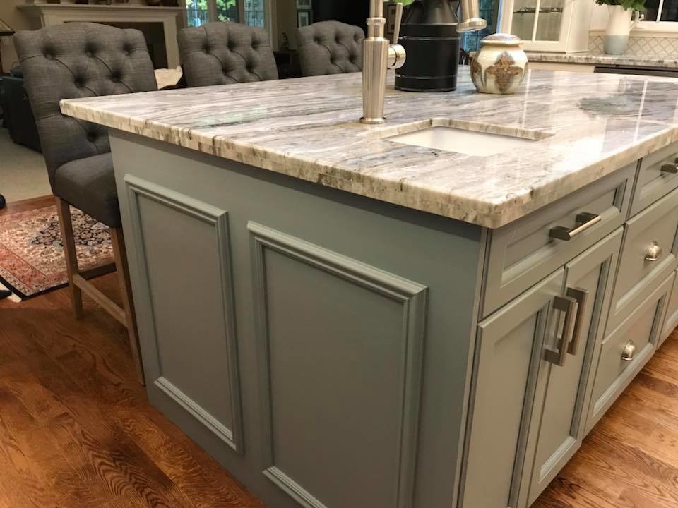 Inspiration for a large classic l-shaped kitchen pantry in Toronto with a belfast sink, recessed-panel cabinets, white cabinets, granite worktops, white splashback, porcelain splashback, stainless steel appliances, medium hardwood flooring, an island and blue worktops.