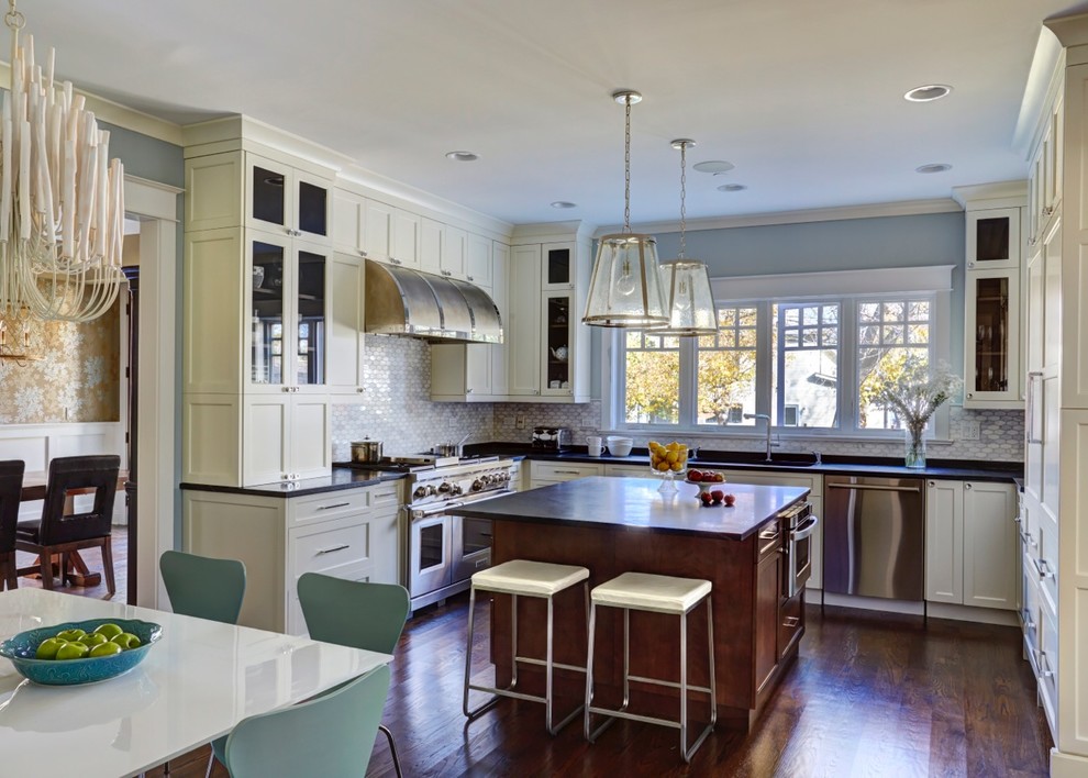 Inspiration for a transitional u-shaped medium tone wood floor eat-in kitchen remodel in Chicago with recessed-panel cabinets, white cabinets, gray backsplash, ceramic backsplash, stainless steel appliances and an island