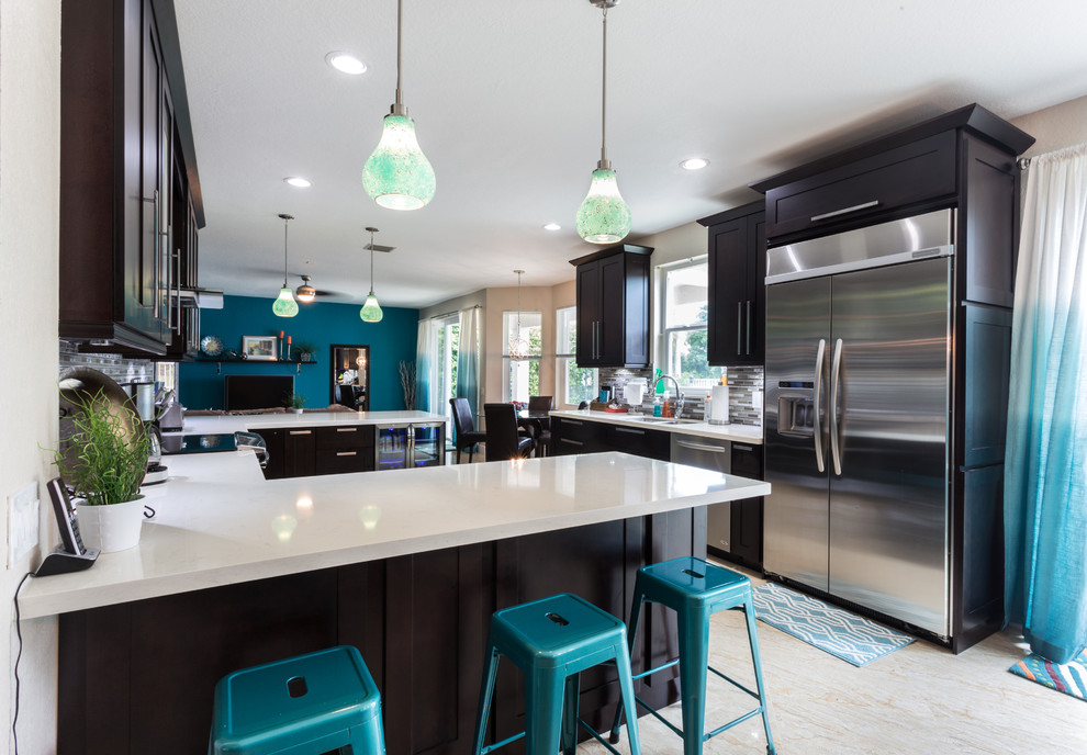Large eclectic u-shaped porcelain tile eat-in kitchen photo in Miami with an undermount sink, shaker cabinets, dark wood cabinets, quartz countertops, multicolored backsplash, metal backsplash, stainless steel appliances and a peninsula