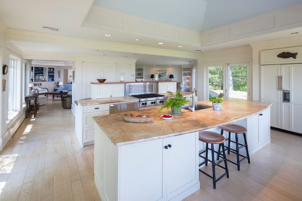 Inspiration for a mid-sized contemporary single-wall painted wood floor and beige floor enclosed kitchen remodel in Other with an undermount sink, flat-panel cabinets, beige cabinets, limestone countertops, stone slab backsplash, colored appliances and an island