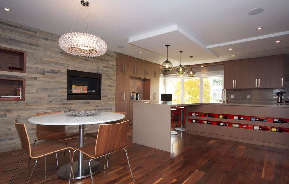 This is an example of a contemporary kitchen/diner in Toronto with flat-panel cabinets, dark wood cabinets, brown splashback and a feature wall.