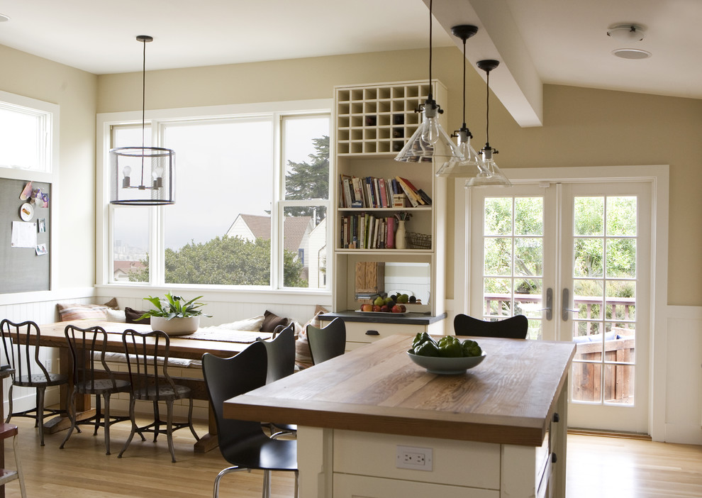 Country eat-in kitchen photo in San Francisco with wood countertops
