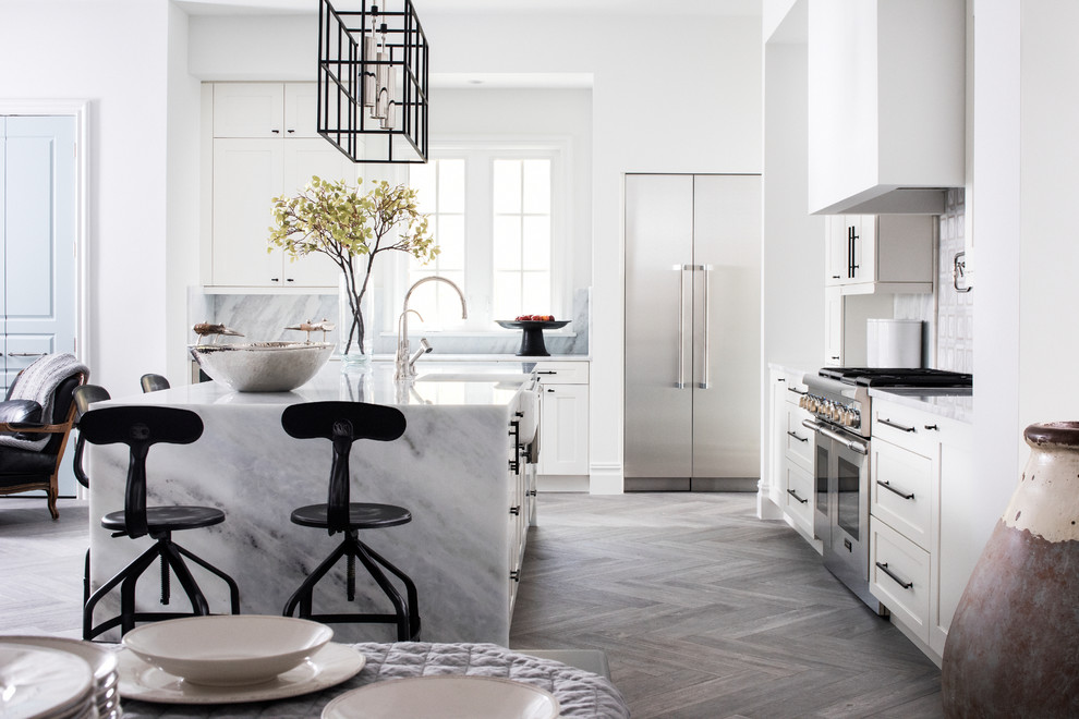 Inspiration for a large contemporary l-shaped gray floor and porcelain tile open concept kitchen remodel in Orlando with a farmhouse sink, shaker cabinets, marble countertops, gray backsplash, marble backsplash, stainless steel appliances and an island