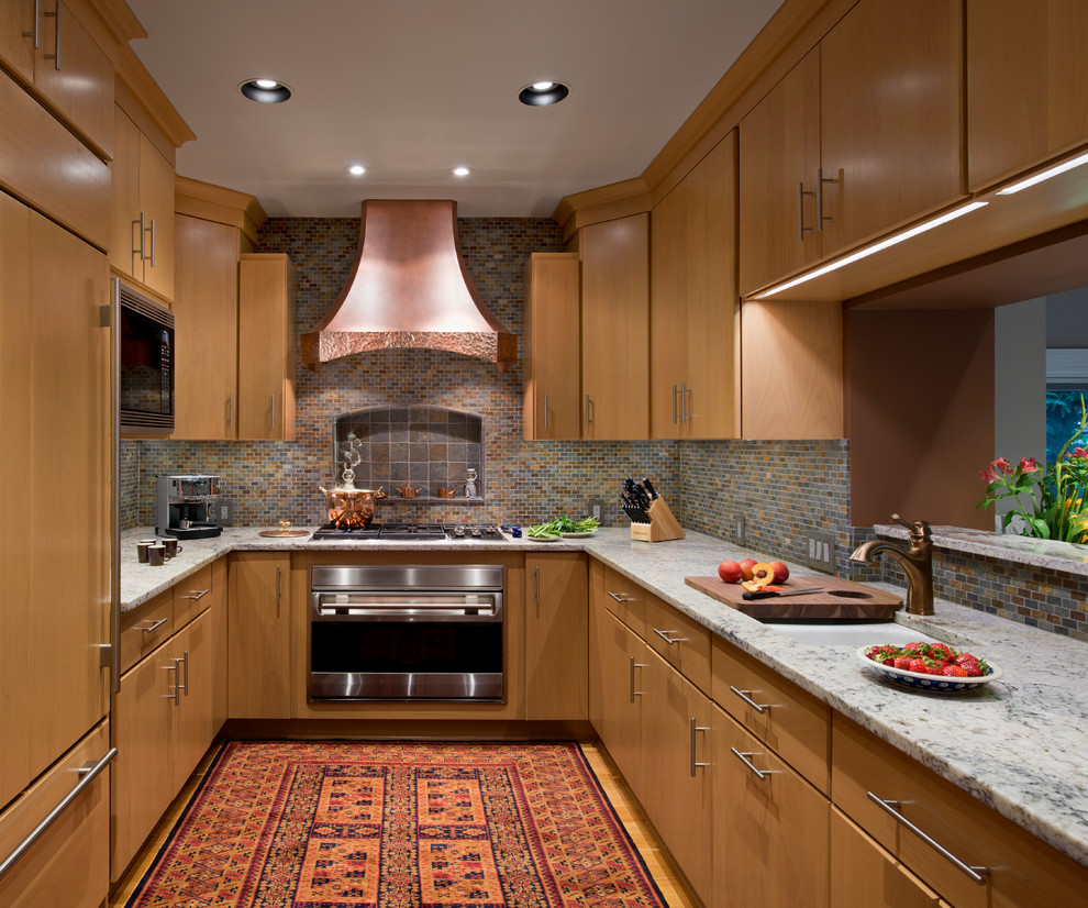 Ejemplo de cocinas en U contemporáneo con salpicadero de azulejos en listel