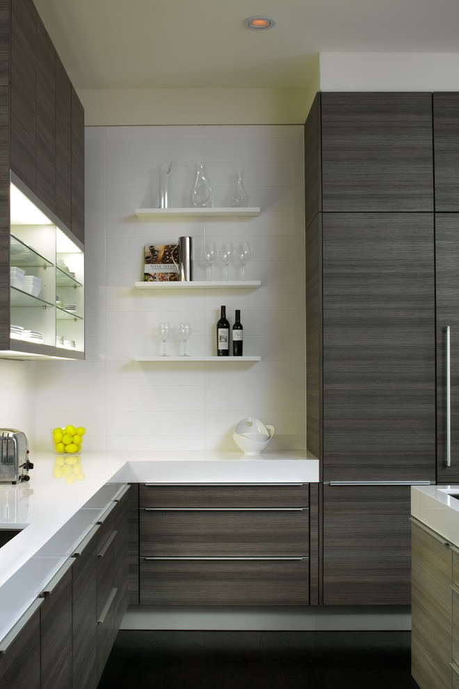 Example of a mid-sized minimalist u-shaped dark wood floor and brown floor kitchen design in Atlanta with an undermount sink, flat-panel cabinets, stainless steel appliances and an island
