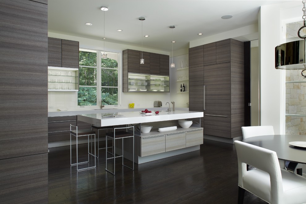 Mid-sized minimalist u-shaped dark wood floor and brown floor kitchen photo in Atlanta with an undermount sink, flat-panel cabinets, stainless steel appliances and an island