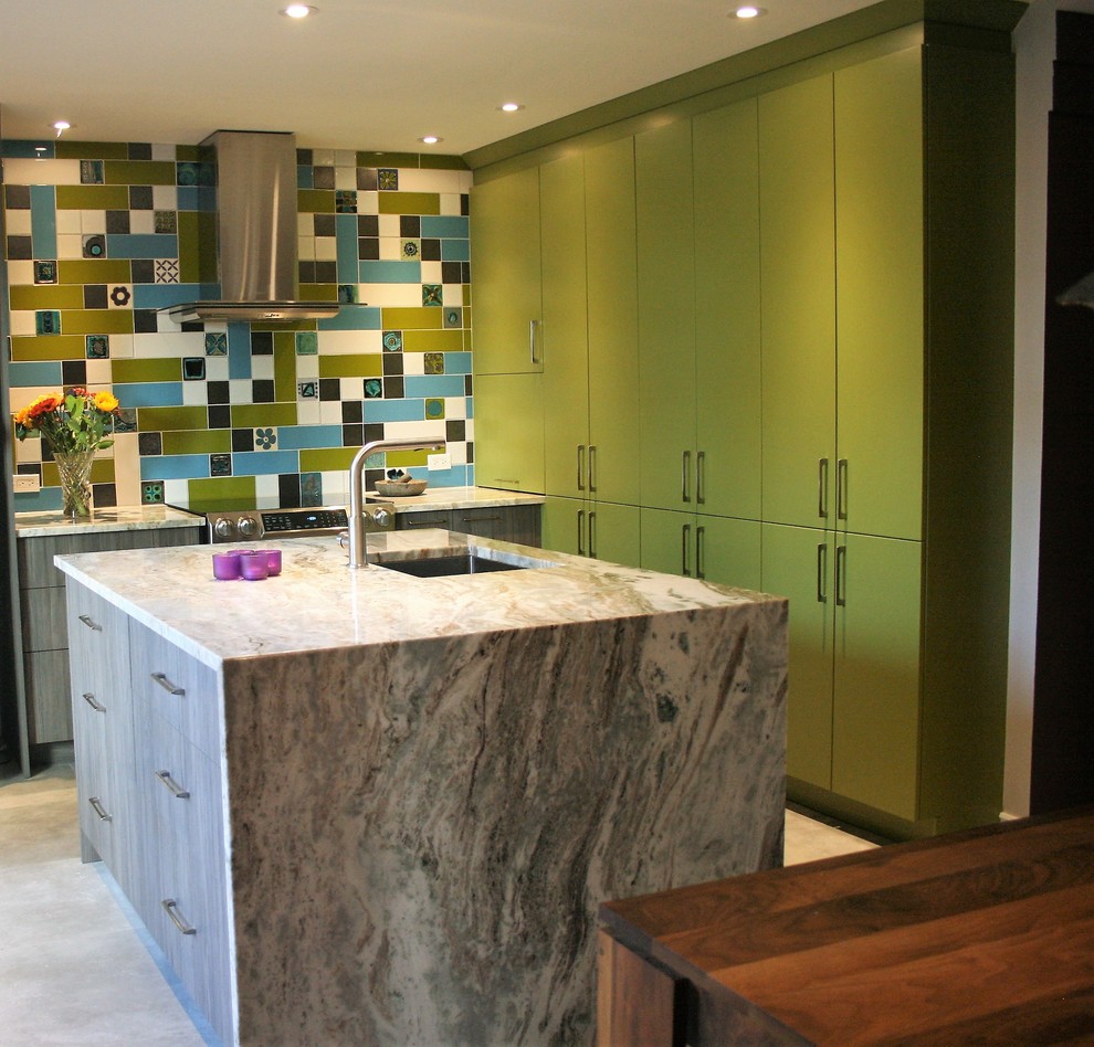 Eat-in kitchen - mid-sized contemporary l-shaped porcelain tile and gray floor eat-in kitchen idea in Montreal with an undermount sink, flat-panel cabinets, green cabinets, quartzite countertops, multicolored backsplash, ceramic backsplash, stainless steel appliances and an island