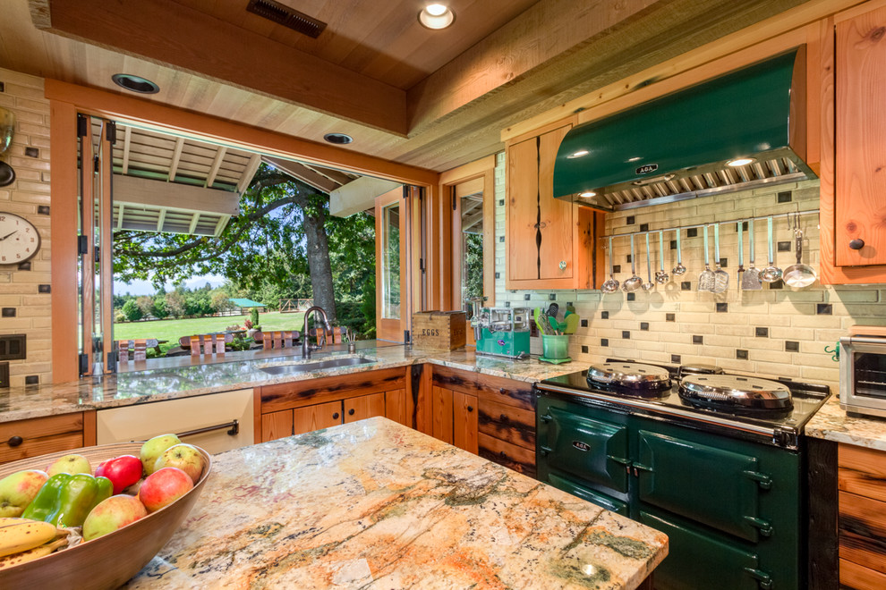 Example of a large cottage medium tone wood floor eat-in kitchen design in Seattle with an undermount sink, medium tone wood cabinets, granite countertops, multicolored backsplash, porcelain backsplash, colored appliances and an island