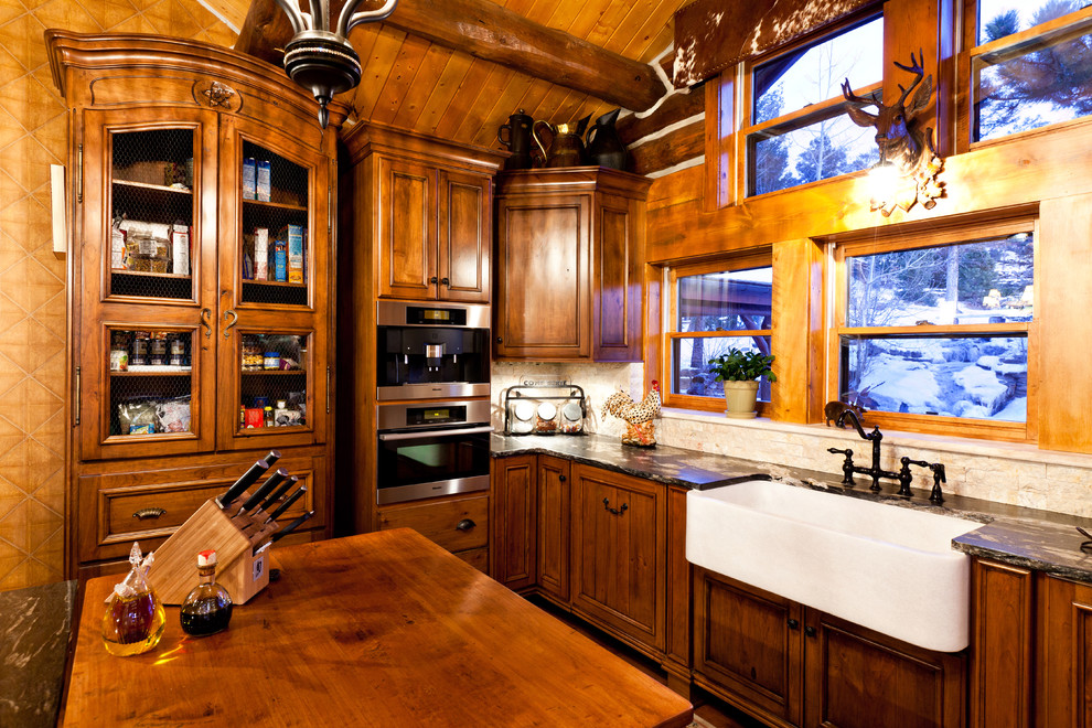 Photo of a rustic kitchen in Denver with a belfast sink and granite worktops.