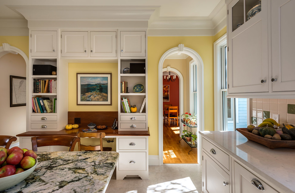Eat-in kitchen - traditional u-shaped eat-in kitchen idea in Boston with an undermount sink, wood countertops, beaded inset cabinets and white cabinets