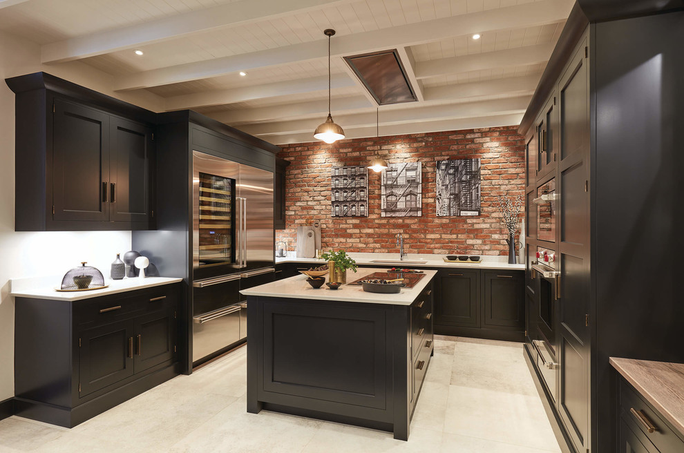 Design ideas for a large traditional u-shaped kitchen/diner in Cambridgeshire with a double-bowl sink, shaker cabinets, black cabinets, quartz worktops, brick splashback, stainless steel appliances, ceramic flooring, an island, beige floors and white worktops.
