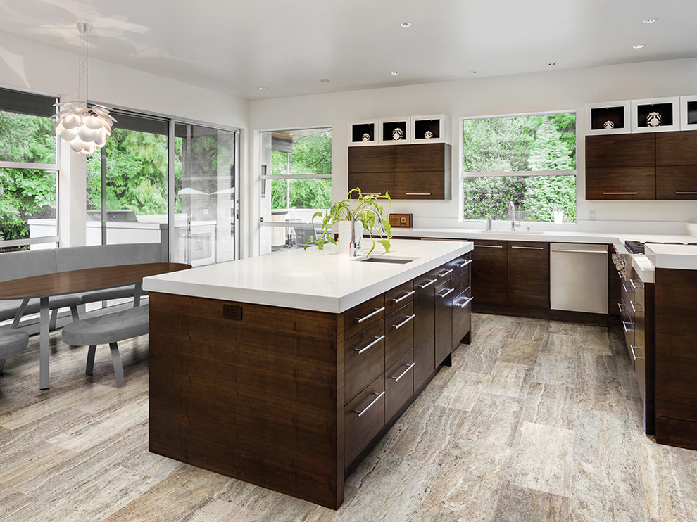 Inspiration for a large transitional l-shaped eat-in kitchen remodel in Philadelphia with an undermount sink, flat-panel cabinets, dark wood cabinets, stainless steel appliances and an island