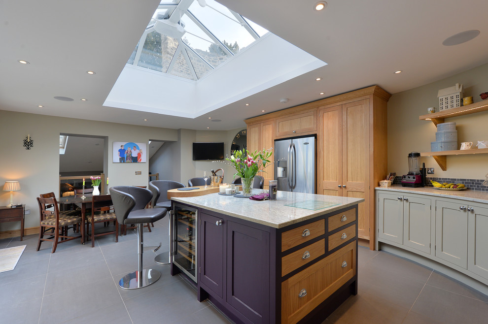 Photo of a medium sized rural grey and purple l-shaped kitchen/diner in Other with shaker cabinets, grey cabinets, grey splashback, stainless steel appliances, an island, marble worktops and mosaic tiled splashback.