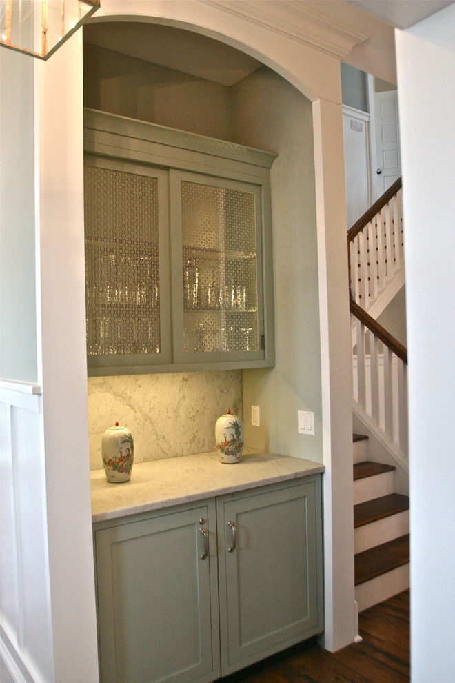 Example of a mid-sized classic u-shaped medium tone wood floor eat-in kitchen design in Philadelphia with shaker cabinets, green cabinets, marble countertops and gray backsplash