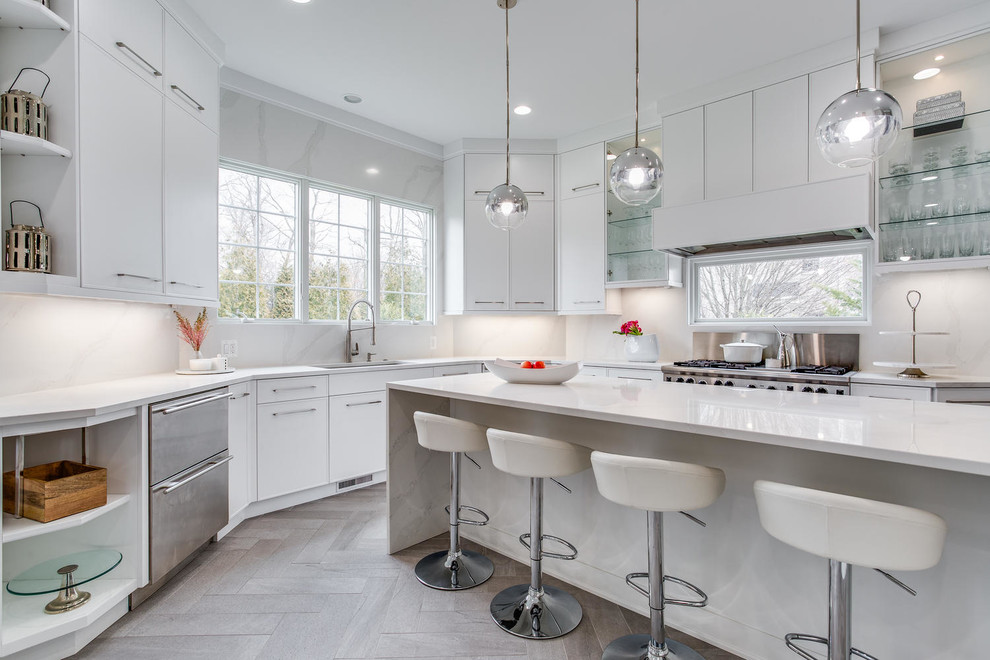 Design ideas for a contemporary kitchen in DC Metro with a submerged sink, flat-panel cabinets, white cabinets, white splashback, stainless steel appliances, light hardwood flooring, an island and white worktops.
