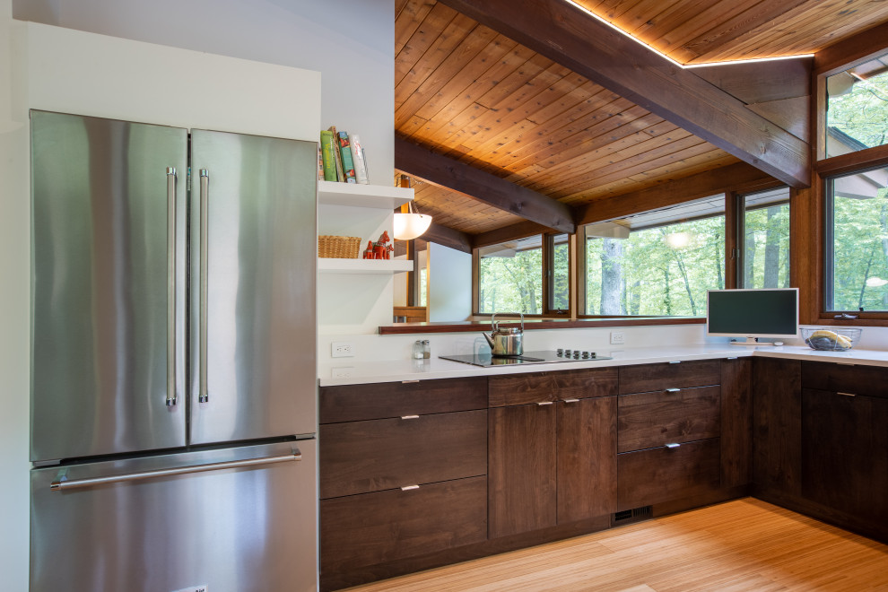 Mid-sized 1960s u-shaped medium tone wood floor, brown floor and exposed beam open concept kitchen photo in DC Metro with an undermount sink, flat-panel cabinets, white cabinets, quartz countertops, white backsplash, stainless steel appliances and white countertops