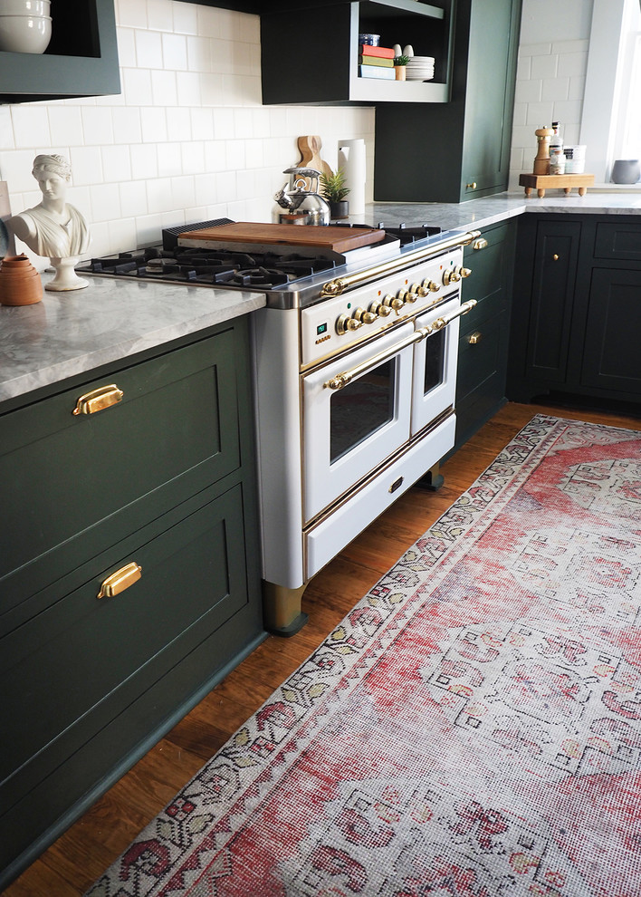 Small transitional l-shaped dark wood floor enclosed kitchen photo in Dallas with shaker cabinets, green cabinets and white backsplash