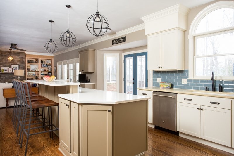 Huge transitional u-shaped dark wood floor open concept kitchen photo in Other with an undermount sink, shaker cabinets, gray cabinets, quartz countertops, blue backsplash, glass tile backsplash, stainless steel appliances and an island