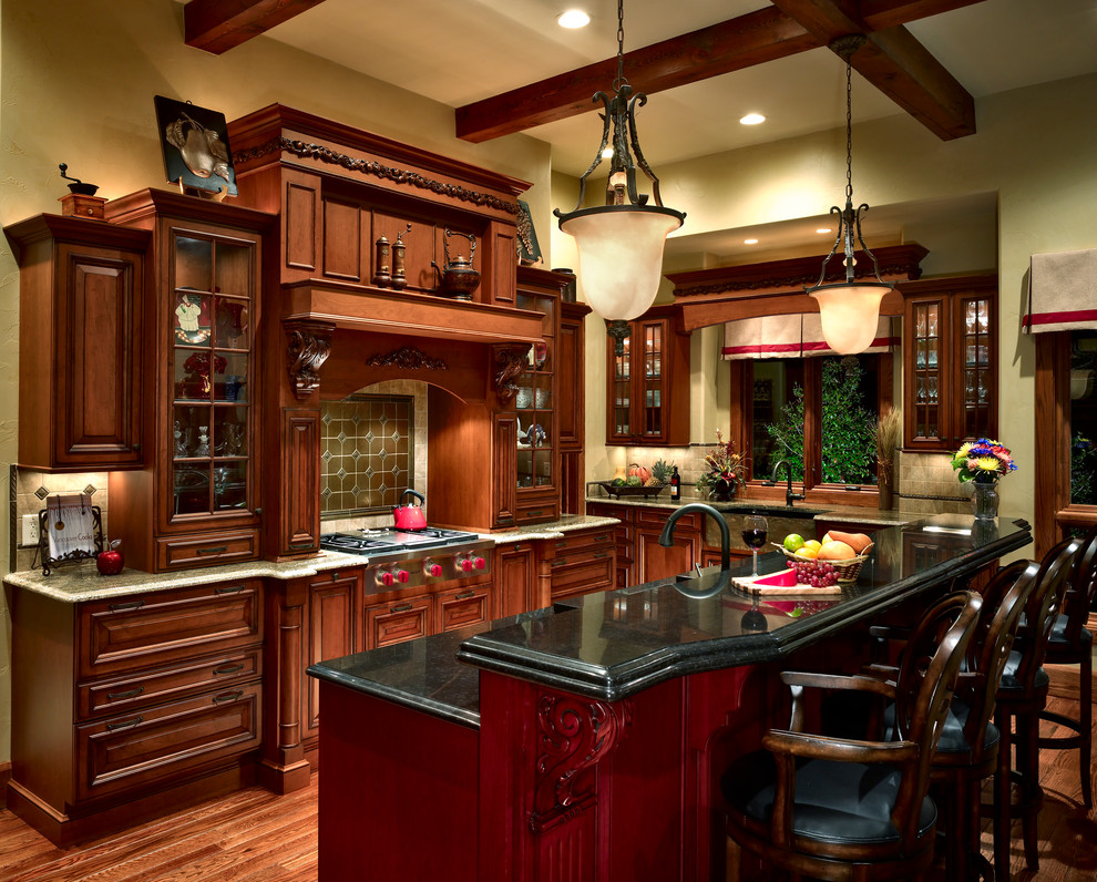 Example of a classic kitchen design in Other with raised-panel cabinets and dark wood cabinets
