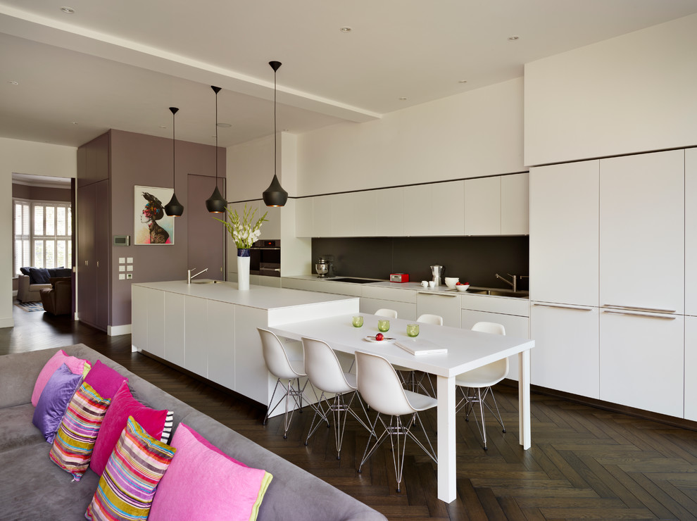 Inspiration for a contemporary galley dark wood floor open concept kitchen remodel in Cheshire with flat-panel cabinets, white cabinets and an island