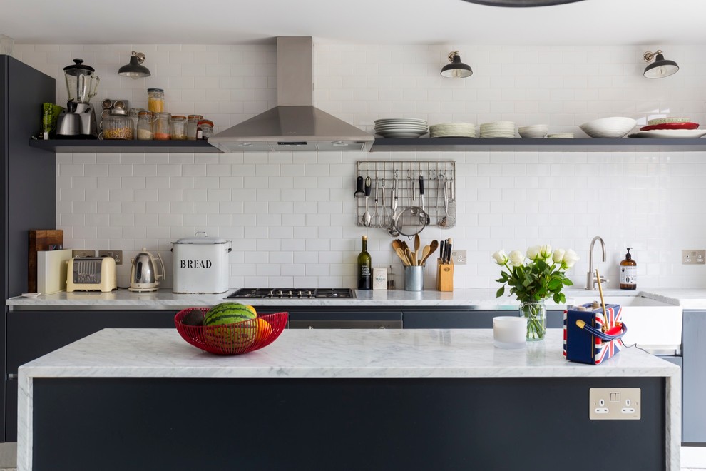 Inspiration for a mid-sized transitional ceramic tile eat-in kitchen remodel in London