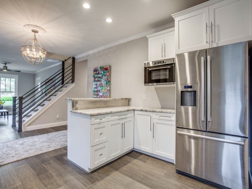 Transitional kitchen featuring Fantasy Brown countertops