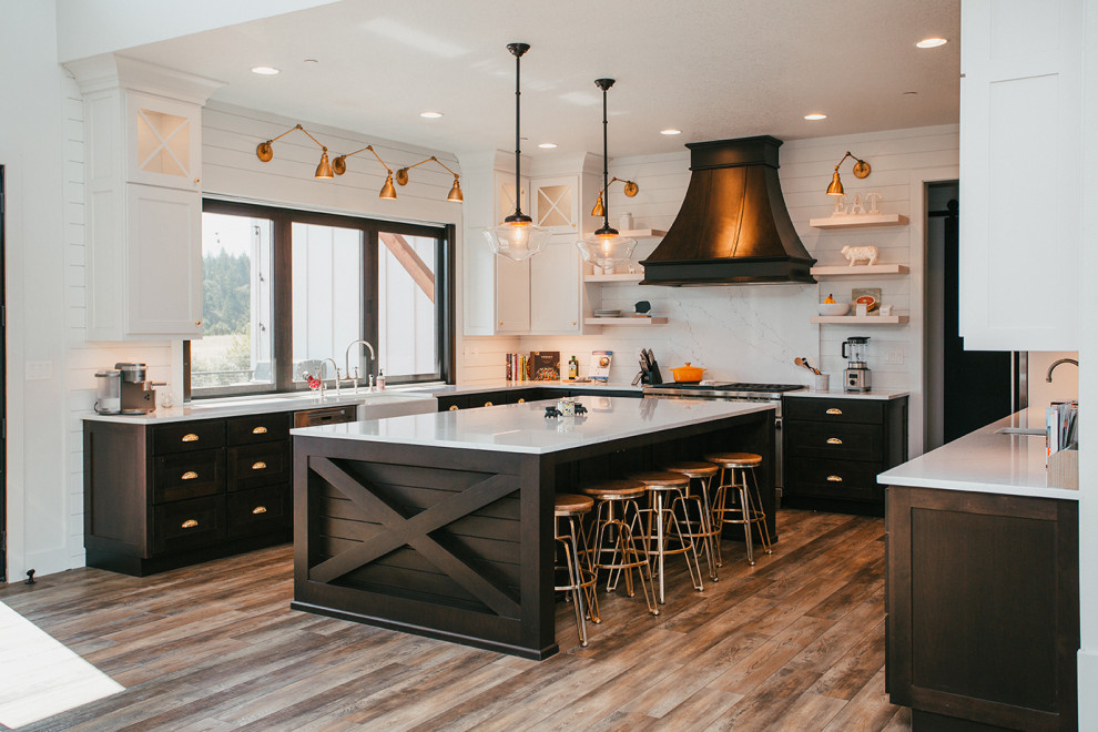 Inspiration for a huge cottage u-shaped medium tone wood floor and brown floor kitchen remodel in Portland with a farmhouse sink, shaker cabinets, dark wood cabinets, quartz countertops, white backsplash, shiplap backsplash, an island and white countertops