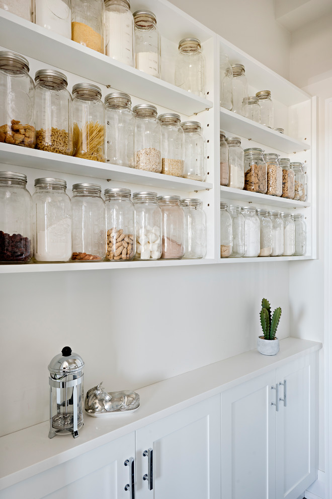 Design ideas for a country kitchen pantry in Toronto with open cabinets and white cabinets.