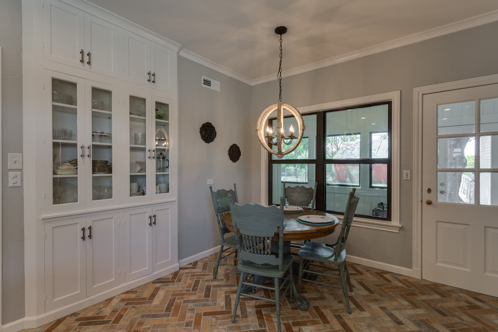 Inspiration for a mid-sized cottage brick floor and multicolored floor kitchen/dining room combo remodel in Dallas