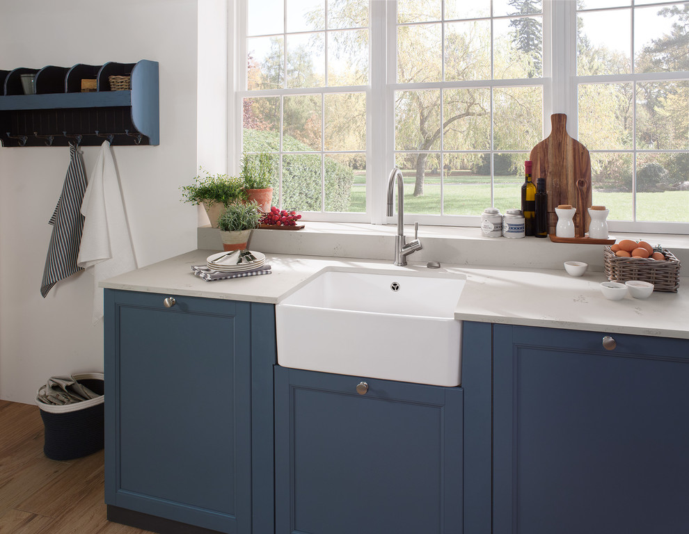 Design ideas for a farmhouse kitchen in London with a belfast sink.