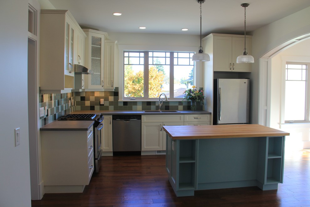 Inspiration for a farmhouse kitchen/diner in Vancouver with shaker cabinets and blue cabinets.
