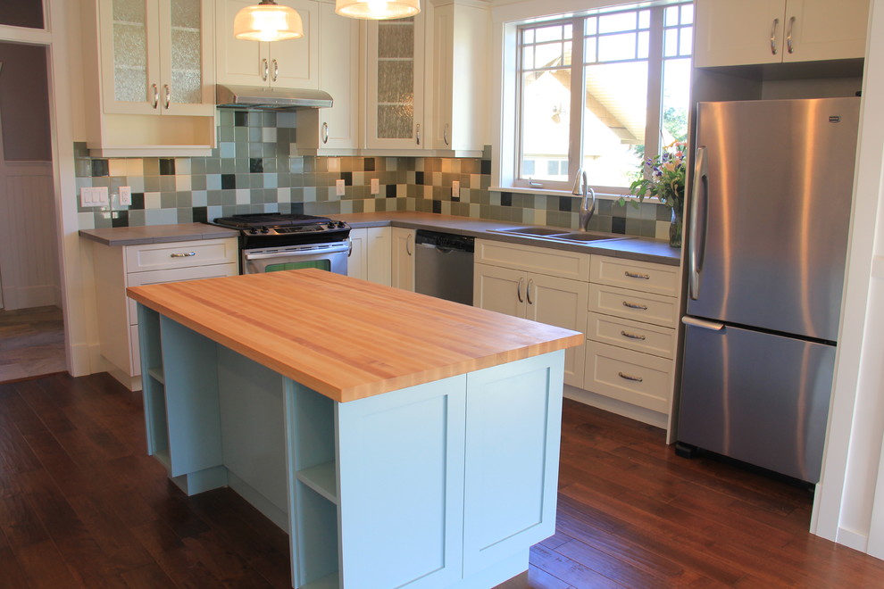Inspiration for a farmhouse eat-in kitchen remodel in Vancouver with shaker cabinets and blue cabinets
