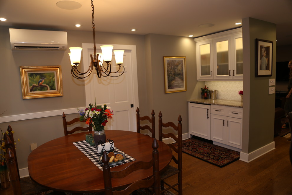 Inspiration for a mid-sized farmhouse medium tone wood floor dining room remodel in Philadelphia