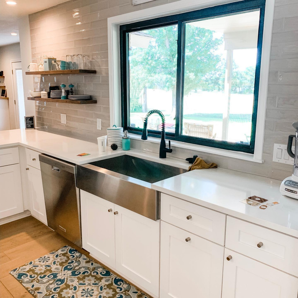 This is an example of a large farmhouse kitchen in Austin.