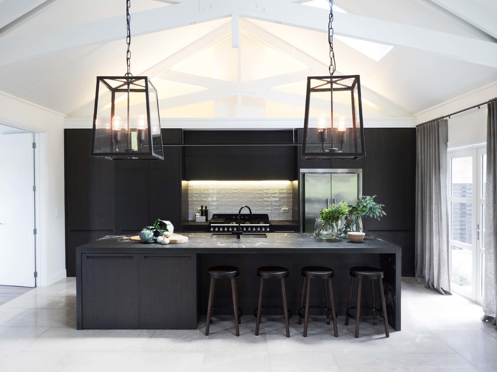 Inspiration for a mid-sized contemporary eat-in kitchen remodel in Auckland with flat-panel cabinets and black cabinets