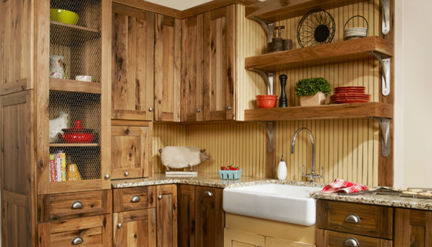 Small farmhouse l-shaped enclosed kitchen photo in Las Vegas with a farmhouse sink, shaker cabinets, medium tone wood cabinets, granite countertops, beige backsplash and no island