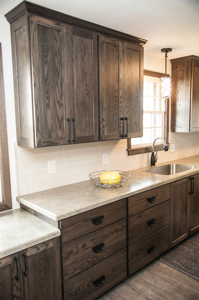 Example of a mountain style eat-in kitchen design in Other with an undermount sink